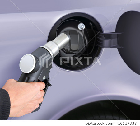 putting gas into the car putting gas into the car 16517338