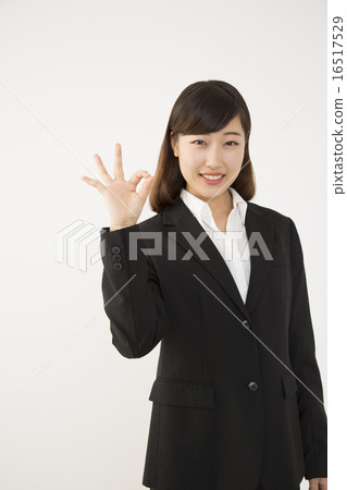 A woman with an OK sign 16517529