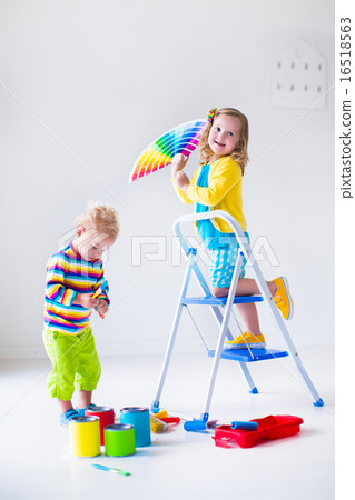 Funny little toddler girl playing with a snow Funny little toddler girl playing with a snow 16518563