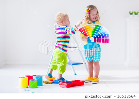 Funny little toddler girl playing with a snow Funny little toddler girl playing with a snow 16518564