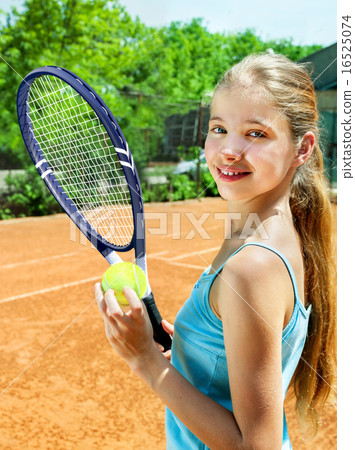 Girl athlete with racket and ball on tennis court Girl athlete with racket and ball on tennis court 16525074