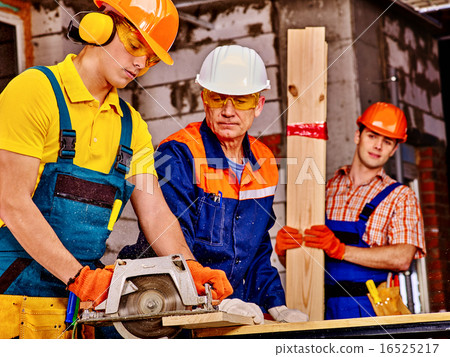 Group people  builder with circular saw . 16525217