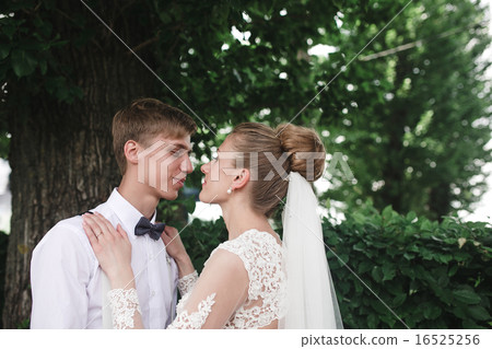 Bride and groom in the park Bride and groom in the park 16525256