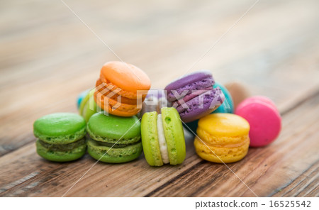 French colorful macarons on wood table French colorful macarons on wood table 16525542