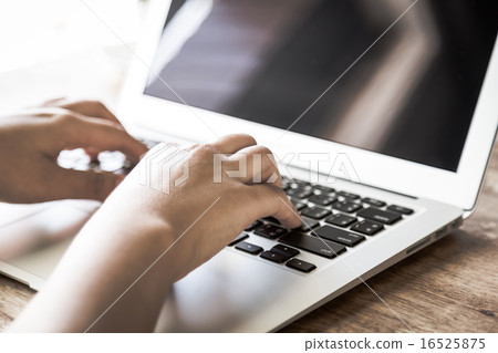 Closeup of business woman hand typing on laptop keyboard ( Filte Closeup of business woman hand typing on laptop keyboard ( Filte 16525875