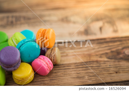 French colorful macarons on wood table French colorful macarons on wood table 16526094