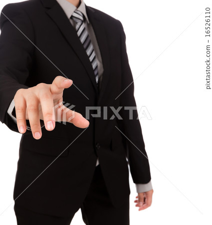 Business man touching an imaginary screen against white backgrou 16526110