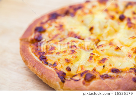 Pizza on wooden background 16526179