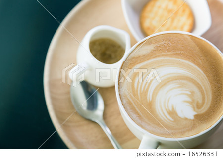 Hot latte art coffee on table ( Filtered image processed vintage 16526331