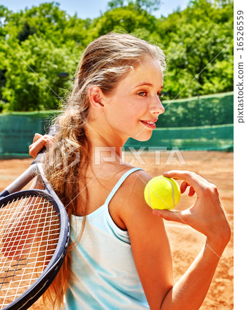 Girl athlete with racket and ball on tennis court Girl athlete with racket and ball on tennis court 16526559