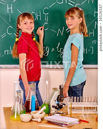 Child in chemistry class. Child in chemistry class. 16526587