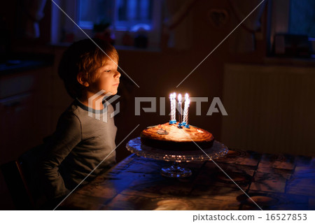 Little kid celebrating his birthday and blowing candles on homem Little kid celebrating his birthday and blowing candles on homem 16527853