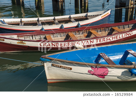 Colored rowing boats in a harbor 16529984