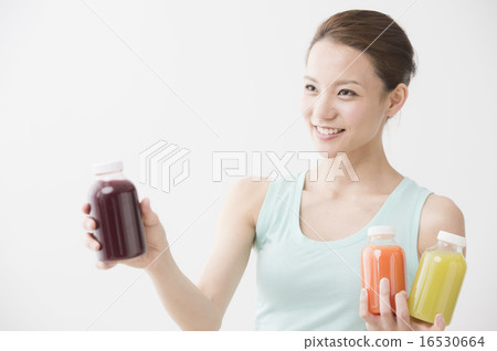 A woman with vegetable juice 16530664