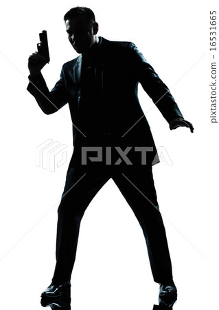 silhouette man spy holding gun silhouette man spy holding gun 16531665