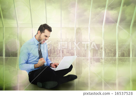 Composite image of cheering businessman sitting using his laptop Composite image of cheering businessman sitting using his laptop 16537528