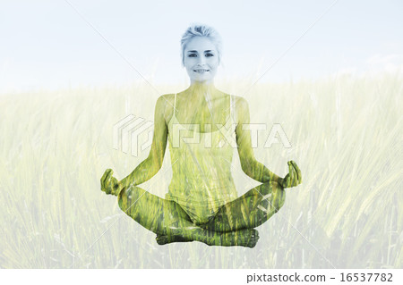 Composite image of toned young woman sitting in lotus pose Composite image of toned young woman sitting in lotus pose 16537782