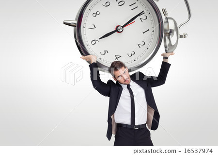 Composite image of businessman in suit lifting up something heav Composite image of businessman in suit lifting up something heav 16537974