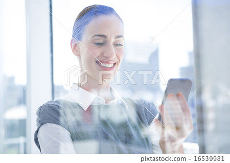 Smiling businessman talking on the phone 16539981