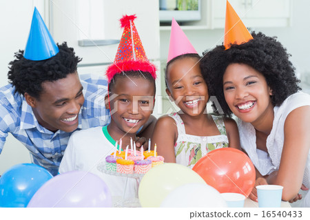 Happy family celebrating a birthday together Happy family celebrating a birthday together 16540433