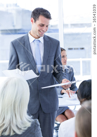 Businessman give a paper 16541039