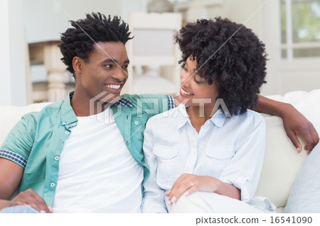 Happy couple on the couch Happy couple on the couch 16541090