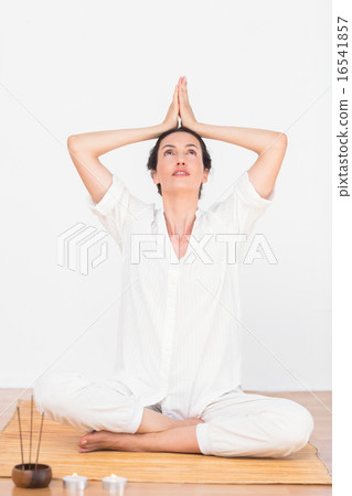 A woman in a meditation position 16541857