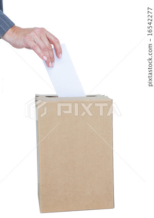 Businessman putting ballot in vote box Businessman putting ballot in vote box 16542277