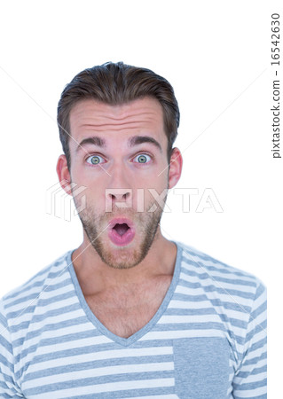 Surprised casual man looking at camera Surprised casual man looking at camera 16542630