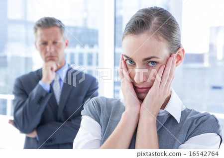 Businesswoman with hands on her face Businesswoman with hands on her face 16542764