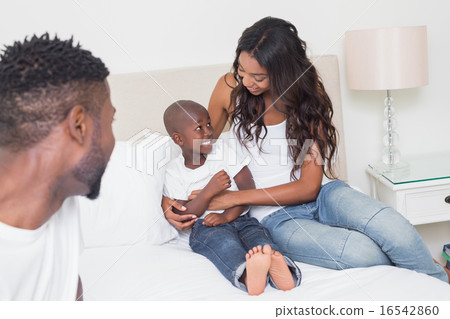 Happy family on the bed 16542860