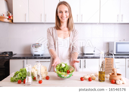 smiling woman making healthy food smiling woman making healthy food 16546576