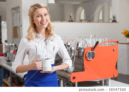 Portrait of young smiling female barista 16547160