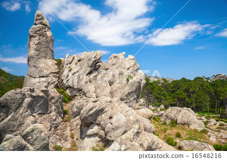 Corsica island, rocky mountains and dramatic sky 16548216