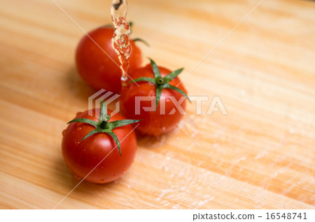 Fresh mini tomatoes on cutting board 16548741