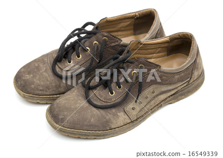 dirty shoes on the white background 16549339