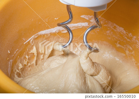 Kneading a dough with a machine Kneading a dough with a machine 16550010