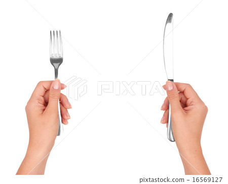 A knife and fork in hands A knife and fork in hands 16569127