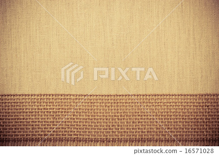 Jute ribbon on linen cloth background 16571028