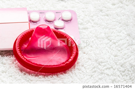 Birth control in pills and condom. 16571404