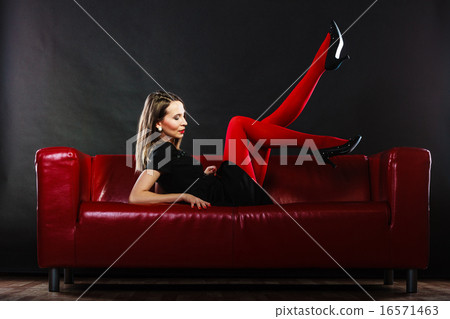 Fashion woman in red pantyhose on couch 16571463
