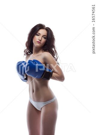 Sexy brunette posing topless in boxing gloves Sexy brunette posing topless in boxing gloves 16574561