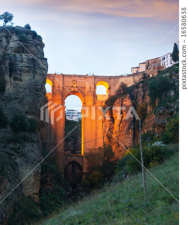 Ancient stone bridge in twilight. Ronda Ancient stone bridge in twilight. Ronda 16580638