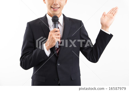 A businessman talking with a microphone A businessman talking with a microphone 16587979