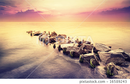 Vintage toned beautiful sea landscape after sunset Vintage toned beautiful sea landscape after sunset 16589243