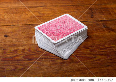 deck of cards on wooden table deck of cards on wooden table 16589592