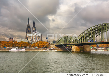 Cologne Cathedral and Hohenzollern Bridge, Germany 16593802