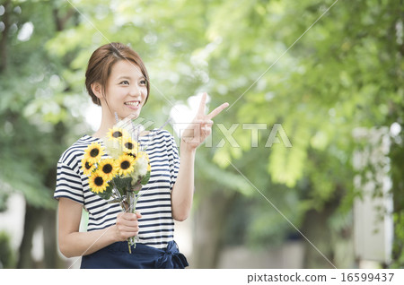 A woman with sunflower A woman with sunflower 16599437