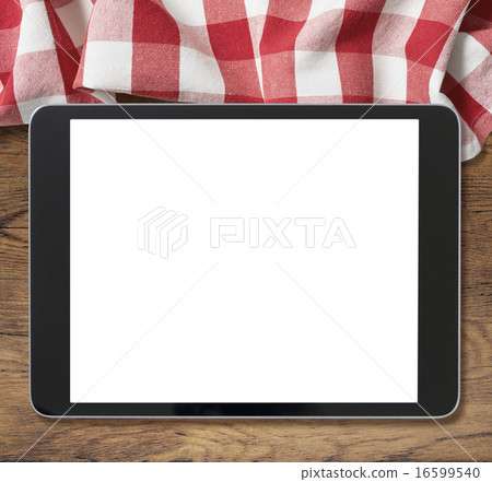 black tablet pc on wooden table and picnic tablecloth black tablet pc on wooden table and picnic tablecloth 16599540