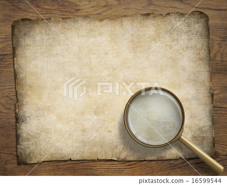 old parchment or map on wooden desk with magnifying glass old parchment or map on wooden desk with magnifying glass 16599544